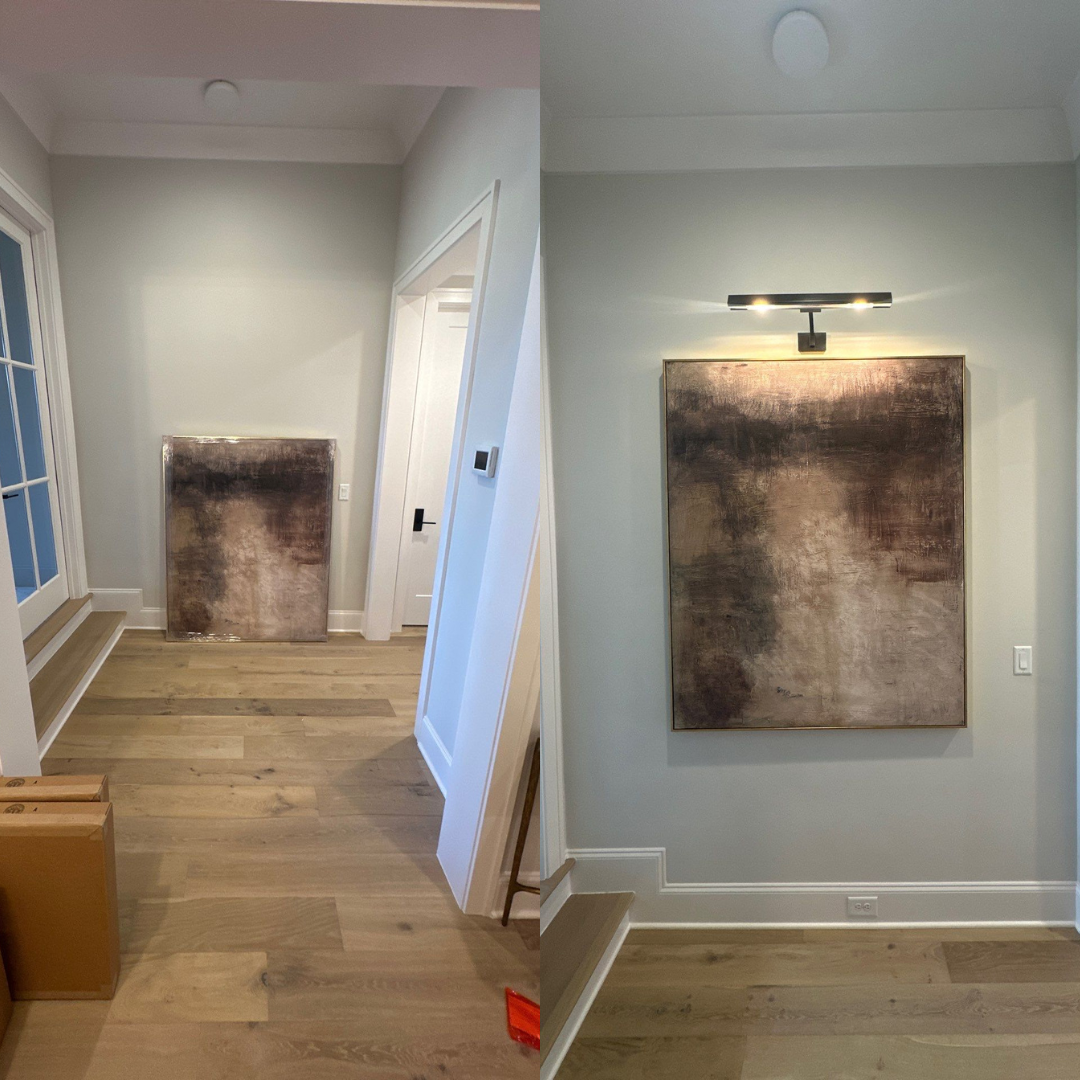 Hallway before and after: Painting on wall, lit by picture light. Light walls and wood floors.